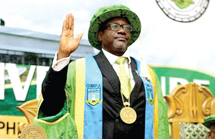 Professor Bondzi-Simpson taking his oath of office at the induction ceremony.